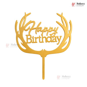 Gold 'Happy Birthday' cake topper with antler design on a white background
