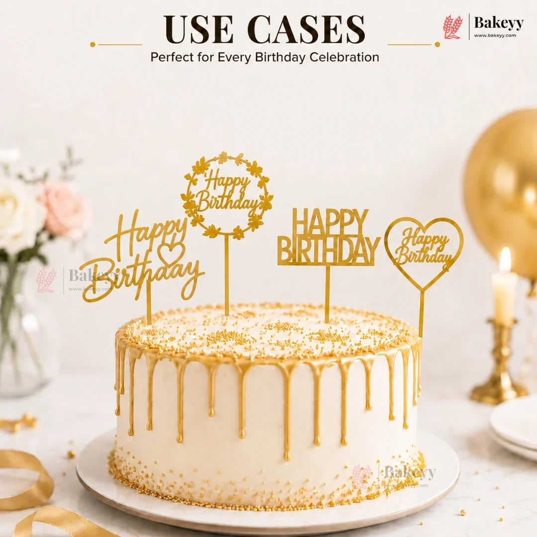 Decorative birthday cake with gold accents and 'Happy Birthday' toppers on a white background.