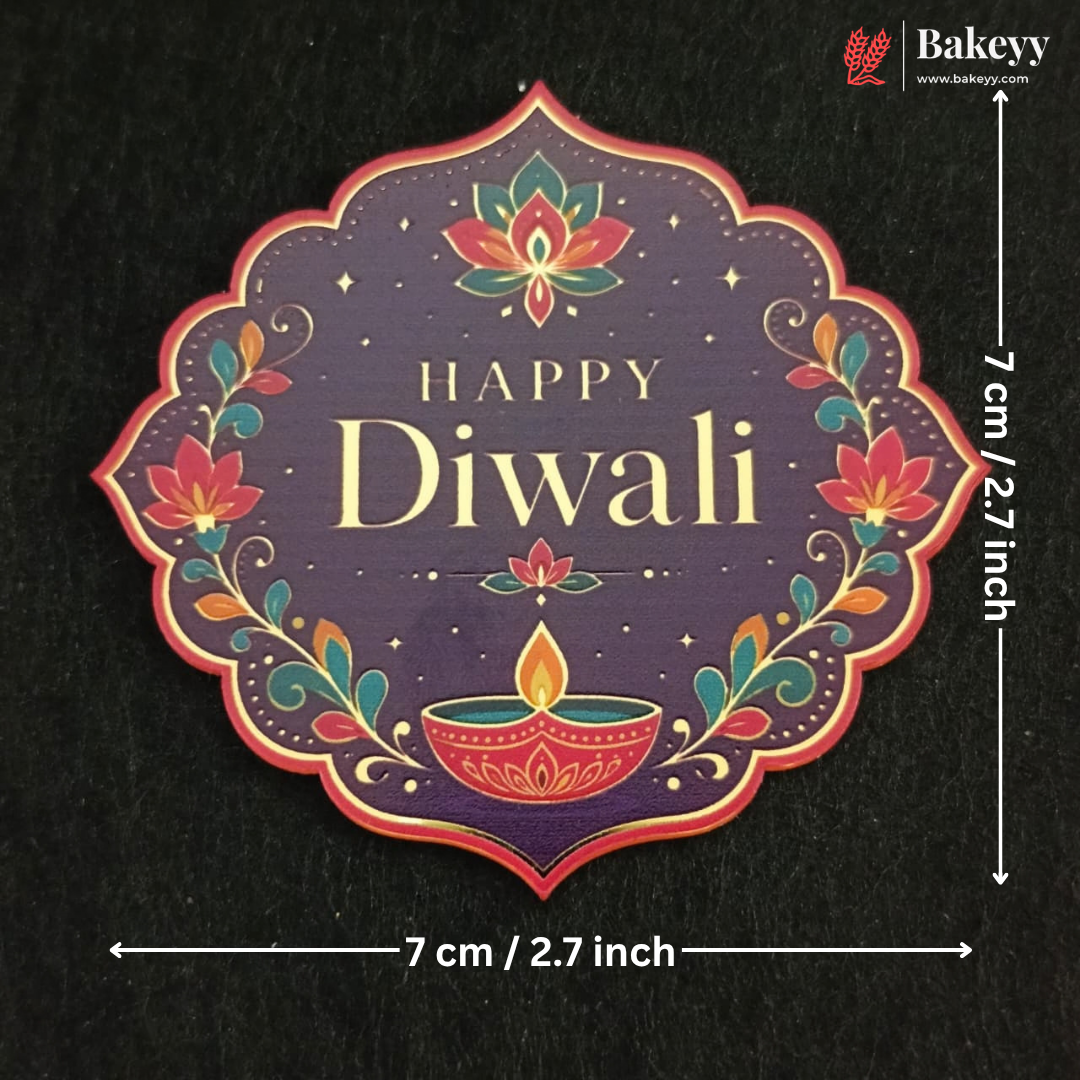 A decorative Diwali-themed label or sticker with the words “Happy Diwali” in gold on a dark purple background, surrounded by floral and diya illustrations in red, orange, and teal. White dimension arrows and text indicate the item is 7 cm / 2.