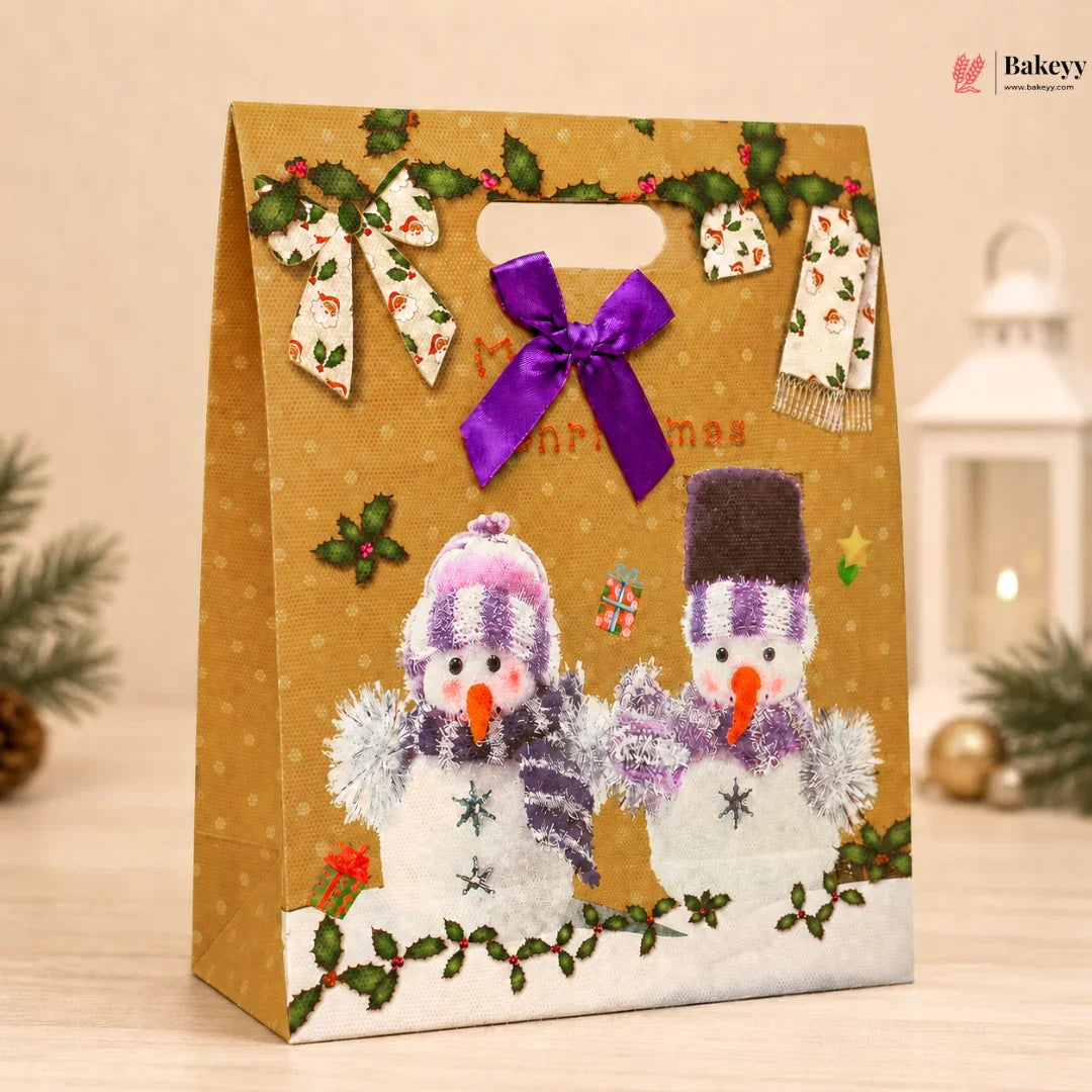 Gift bag with snowmen design and festive decorations on a neutral background