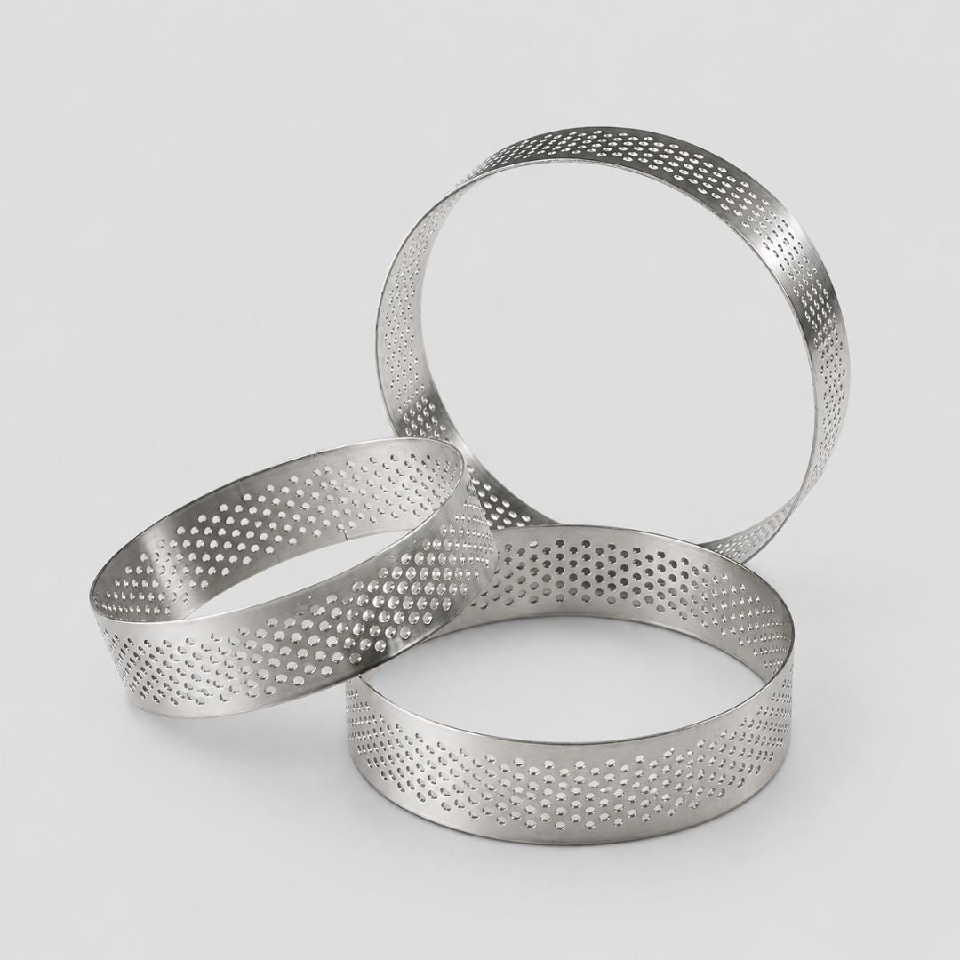 Set of three metal ring cookie cutters on a light gray background