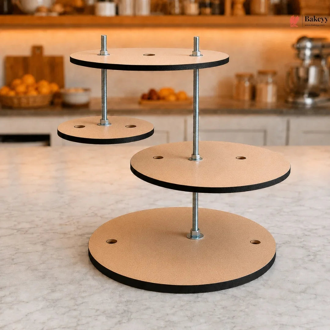 Three-tiered wooden cake stand on a kitchen counter with blurred background