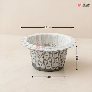 Bakey disposable cup with geometric pattern and measurements on a beige background