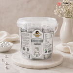 Clear container of silver sugar paste with a label on a marble surface, featuring the Bakey brand.