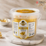 Container of Gold Sugar Paste with a visible label on a marble surface, featuring the Bakeyy brand.