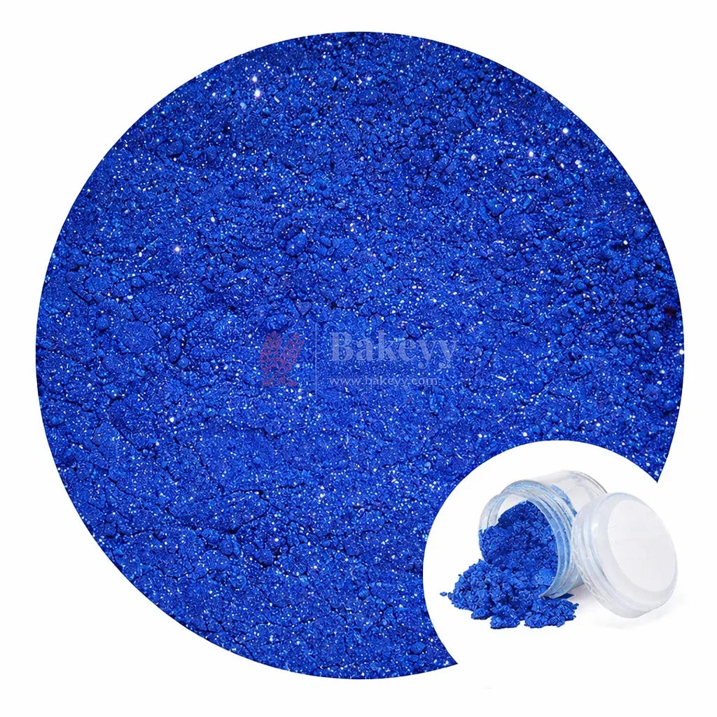 Blue edible glitter dust for cakes and desserts from Bakeyy.com, shown in a clear jar.