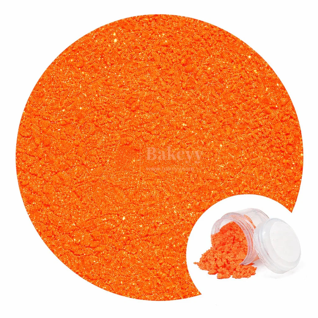 Bright orange glitter dust in a small container for cake decorating from Bakeyy.com