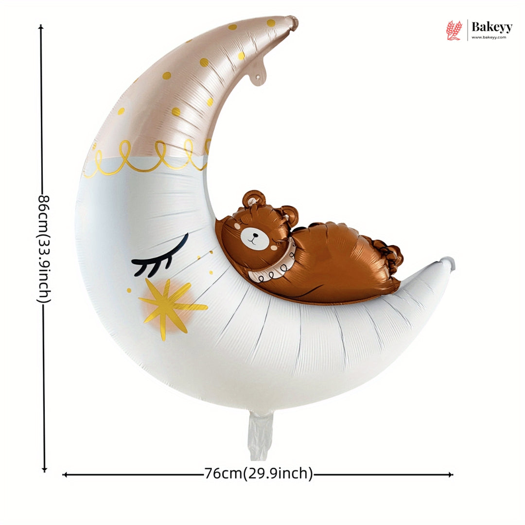 Balloon shaped like a crescent moon with a bear design, featuring dimensions on a white background.