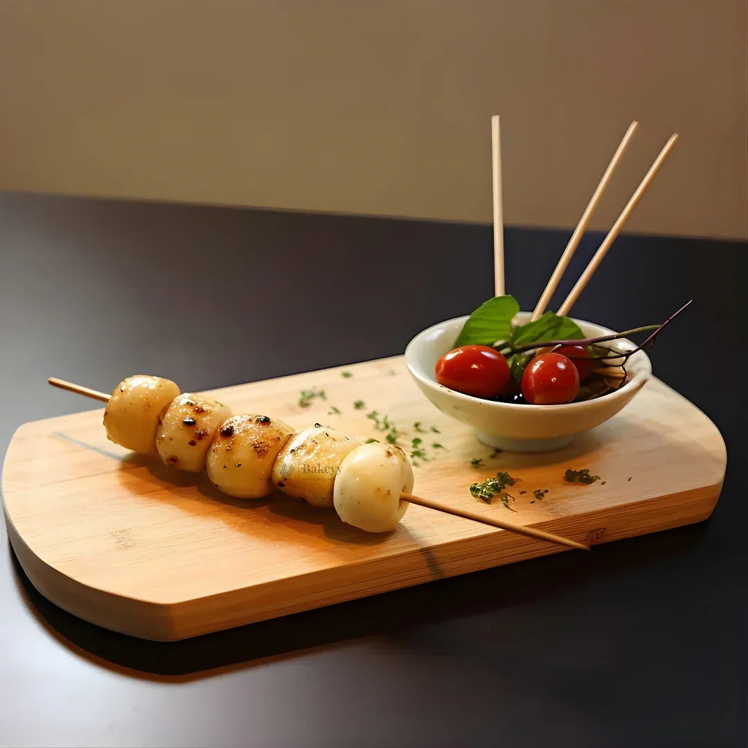Bamboo skewers with grilled food and vegetables on wooden board, Bakeyy baking supplies