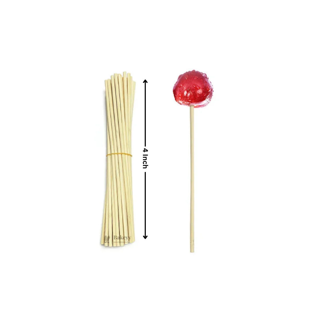 Bamboo lollipop sticks 4 inch, bundled beside a red lollipop, Bakeyy baking supplies