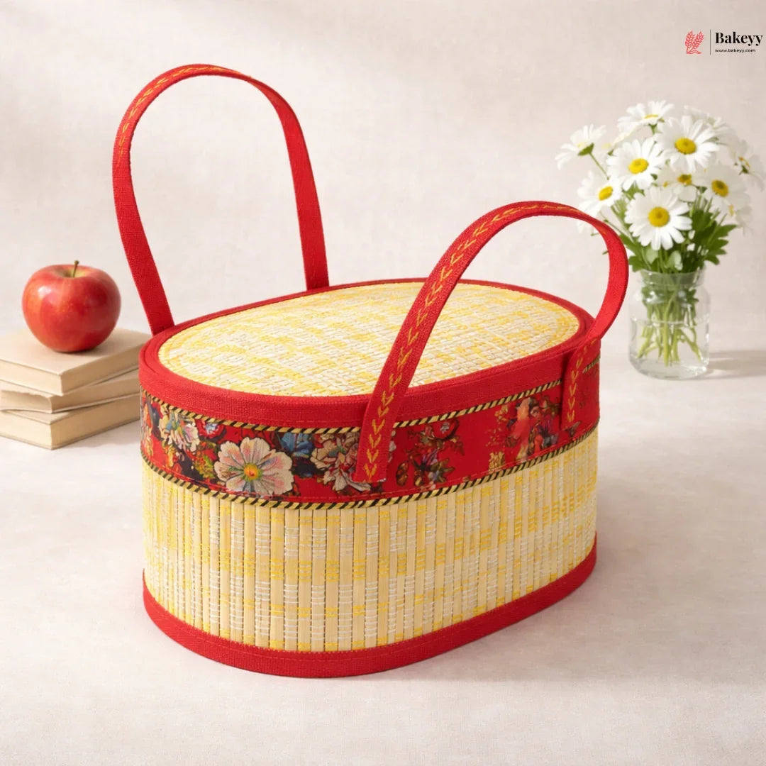Beige wooden oval basket with red handles, floral fabric trim, and metallic weave design