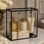 Gift set with Chanel perfume, candle, and Aesop hand cream in a decorative box.