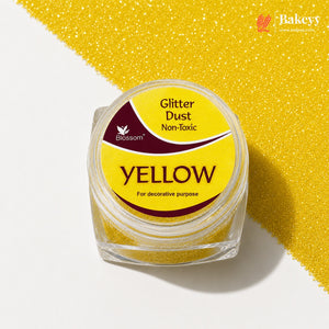 Yellow glitter dust in a clear container with a yellow label on a white background