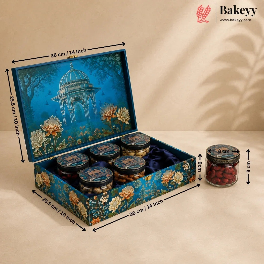 Decorated rectangular gift box containing six small jars of red dates, shown with dimension arrows and labels on a beige background. The box lid features a blue pavilion illustration with floral details, and a single jar is shown beside it with size annotations.