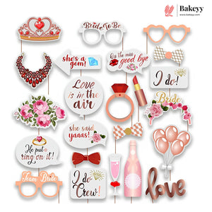 Collection of paper photo booth props with various designs and text, featuring the Bakeyy brand.