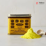 Bush Lemon Yellow Powder with a scoop of powder on a light gray background