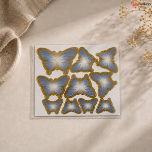 Butterfly-shaped decorative stickers on a beige surface with a soft focus background