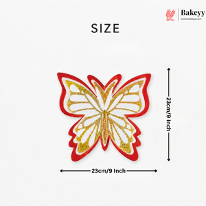 Butterfly-shaped patch with red and gold glittery design, size indicated as 23cm/9 inch, on a white background with Bakeyy branding.