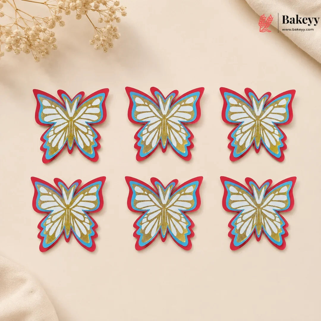 Colorful butterfly-shaped cookies on a beige surface with 'Bakeyy' branding.
