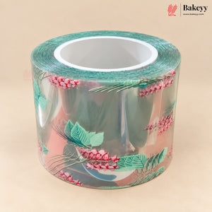 A roll of clear adhesive tape with a botanical pattern of pink berries and green leaves, displayed on a solid beige background. The Bakeyy logo is visible in the top right corner.