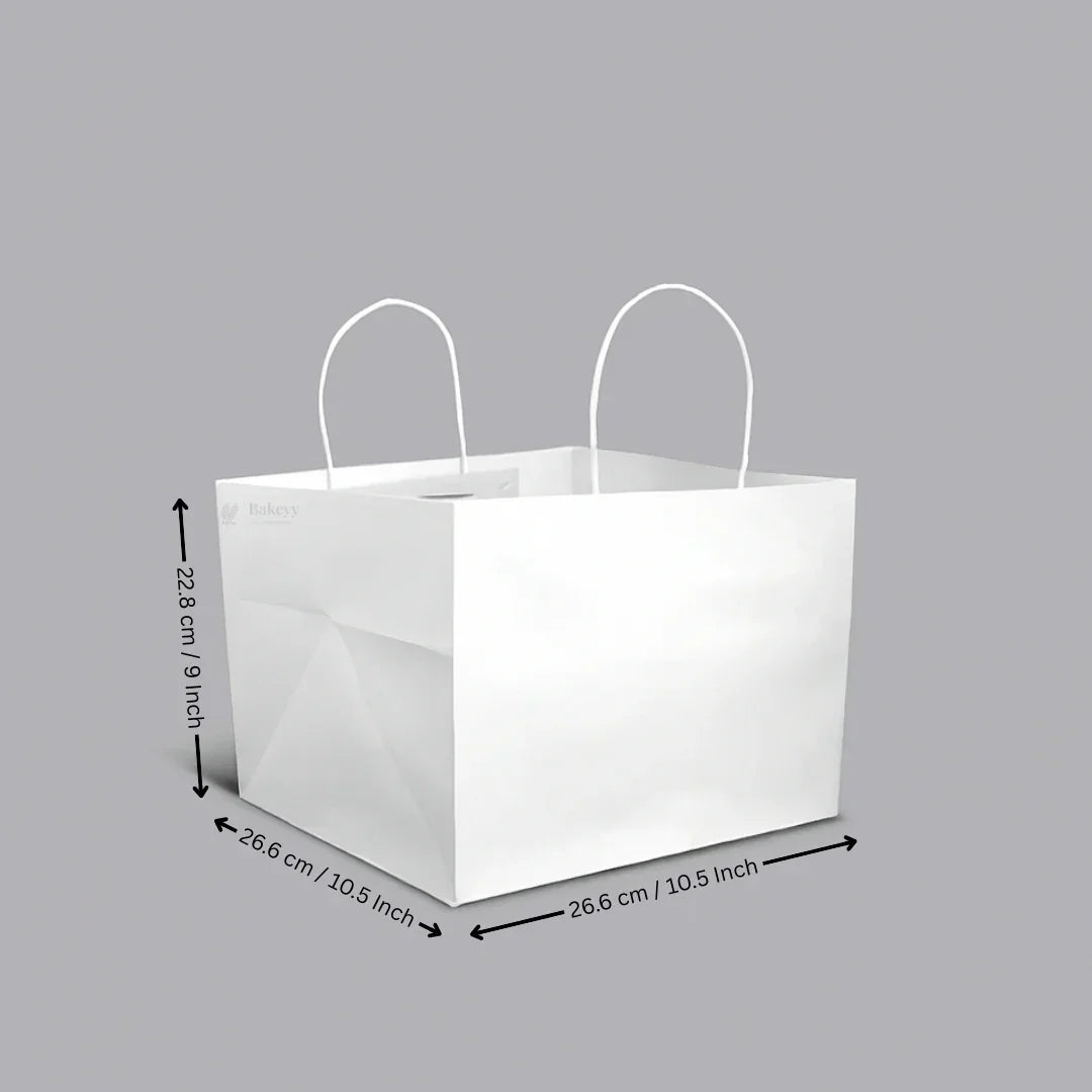 White cake bag with handles and dimensions, ideal for bakery packaging from Bakeyy.com