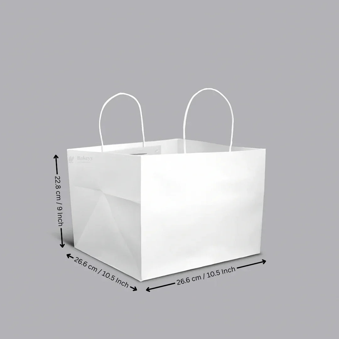 White cake bag with handles and dimensions, ideal for bakery packaging from Bakeyy.com