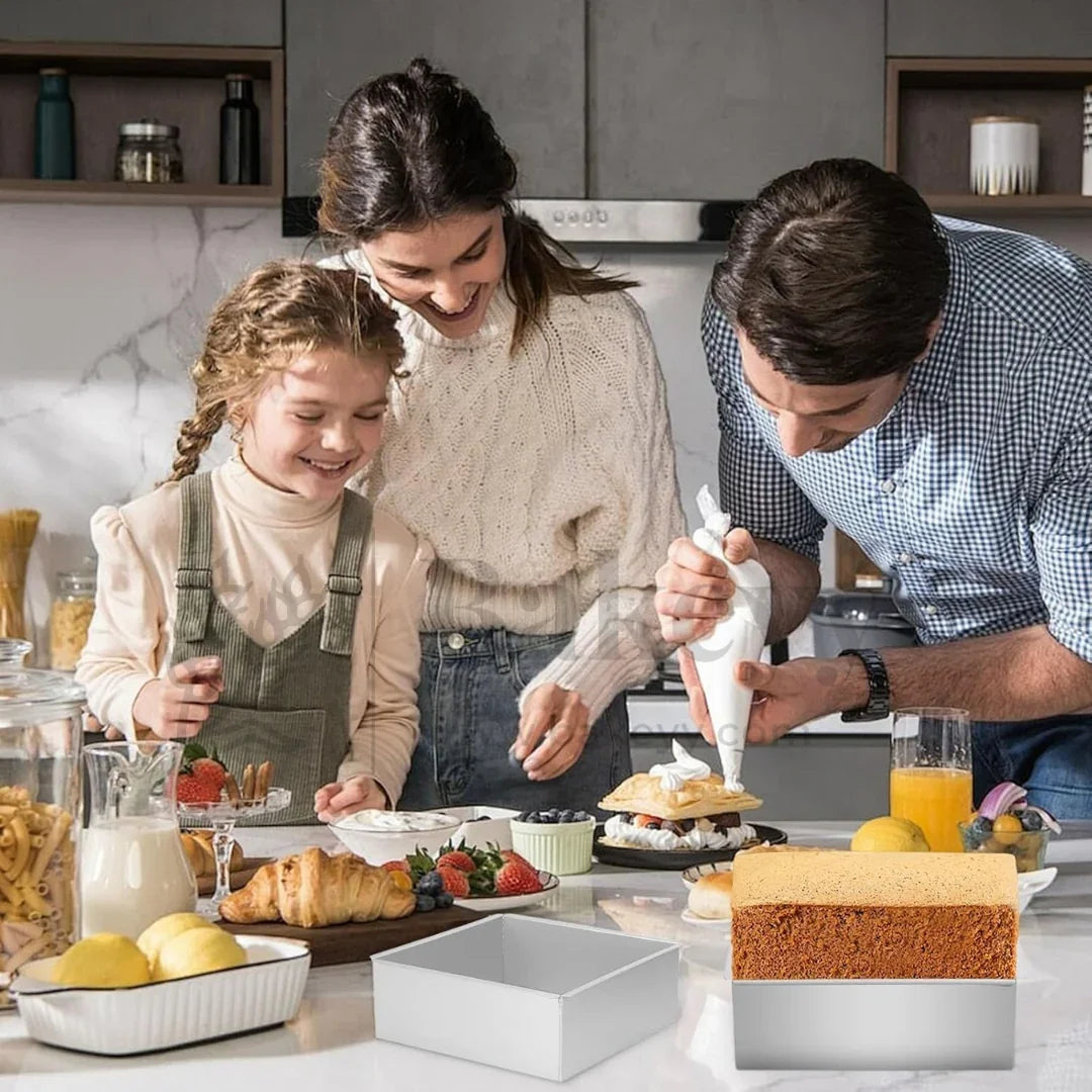 Family baking together in modern kitchen with square cake pan and fresh baked cake, Bakeyy.com