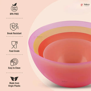 Set of colorful silicone bowls with BPA-free and other feature icons on a light pink background.