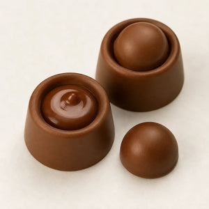 Three small brown spherical and cup-shaped silicone or rubber pieces arranged on a plain light background.