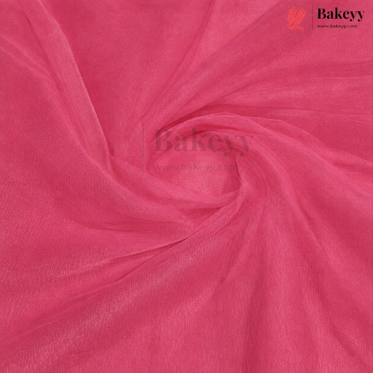 A close-up of bright pink organza fabric with a sheer, lightweight texture, arranged in elegant swirls. The Bakeyy brand logo is visible in the top right corner.