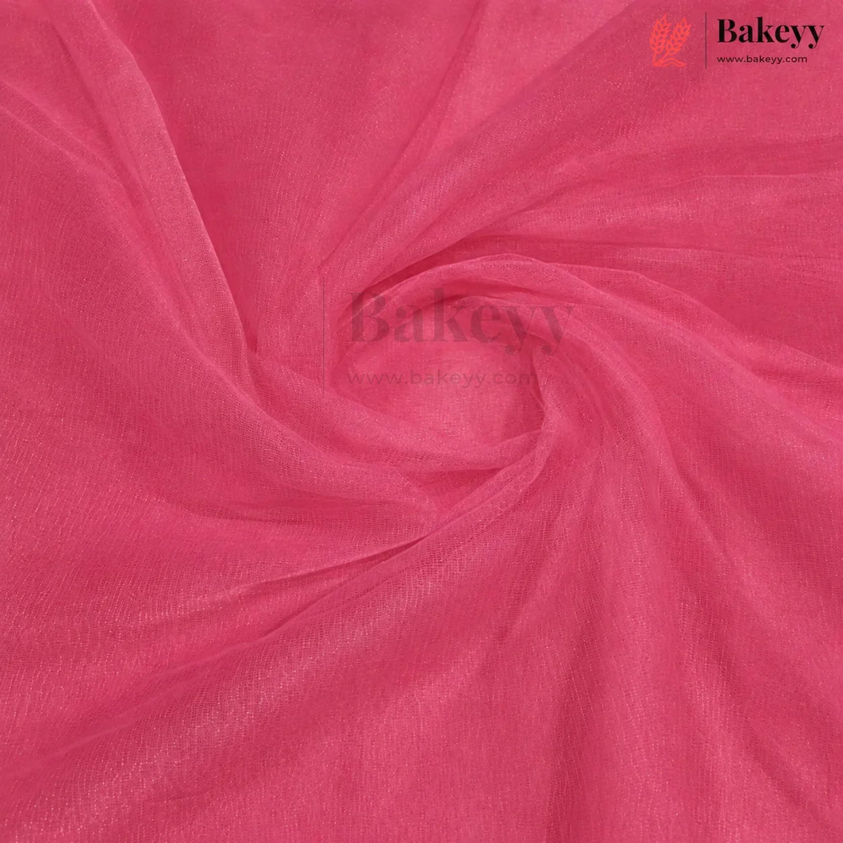 A close-up of bright pink organza fabric with a sheer, lightweight texture, arranged in elegant swirls. The Bakeyy brand logo is visible in the top right corner.