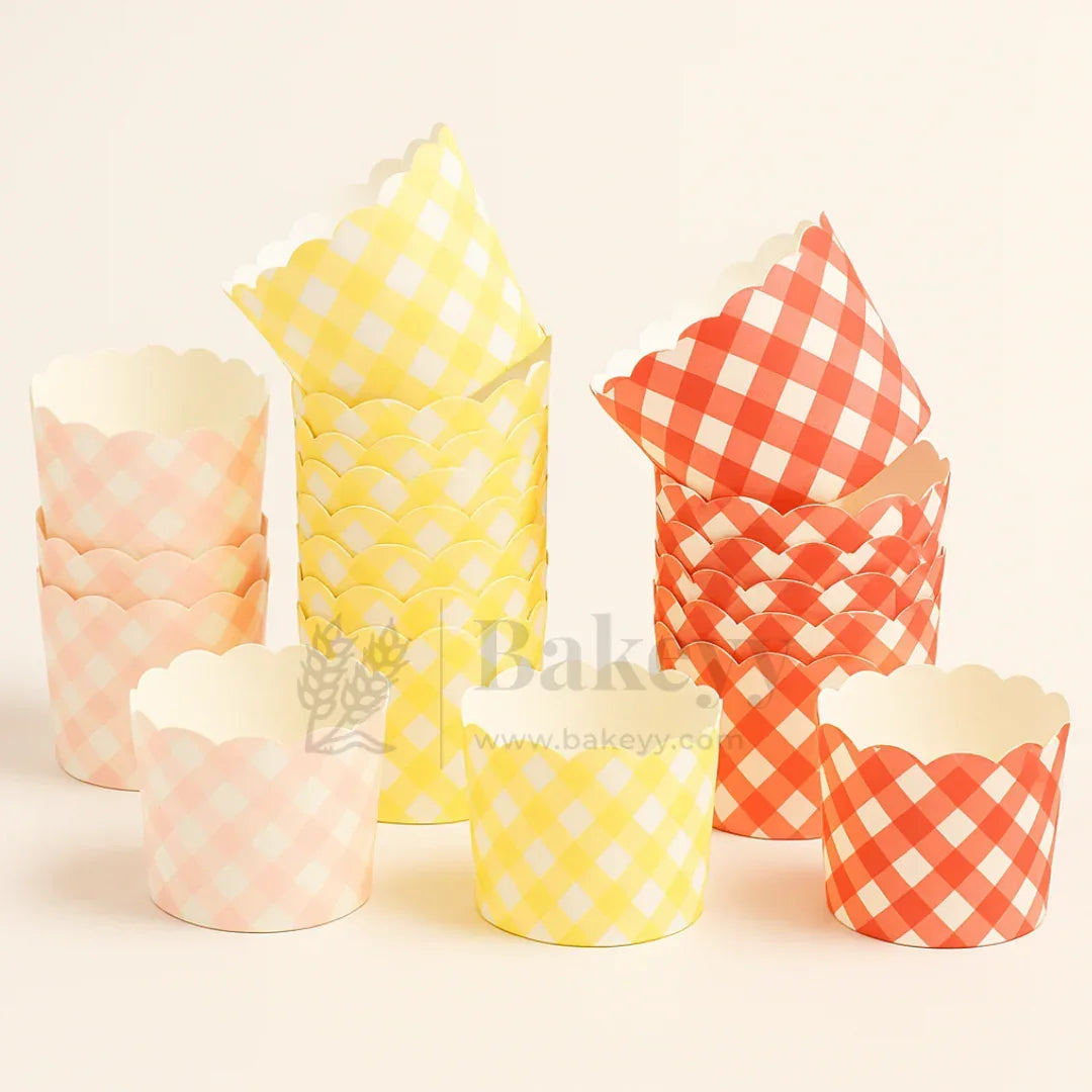 Set of colorful checkered cupcake liners on a light beige background