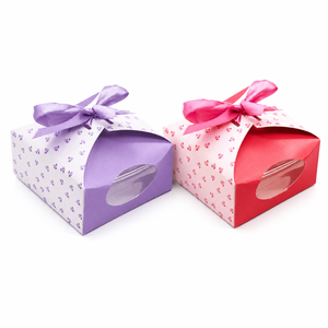 Two gift boxes with ribbons, one purple and one red, on a white background.