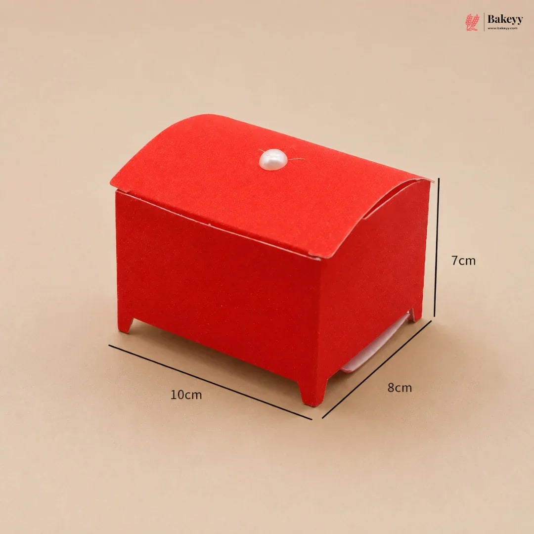Red cardboard box with dimensions on a beige background