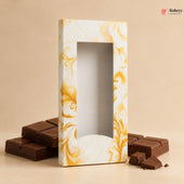 Chocolates in a decorative box with marbled design on a beige background