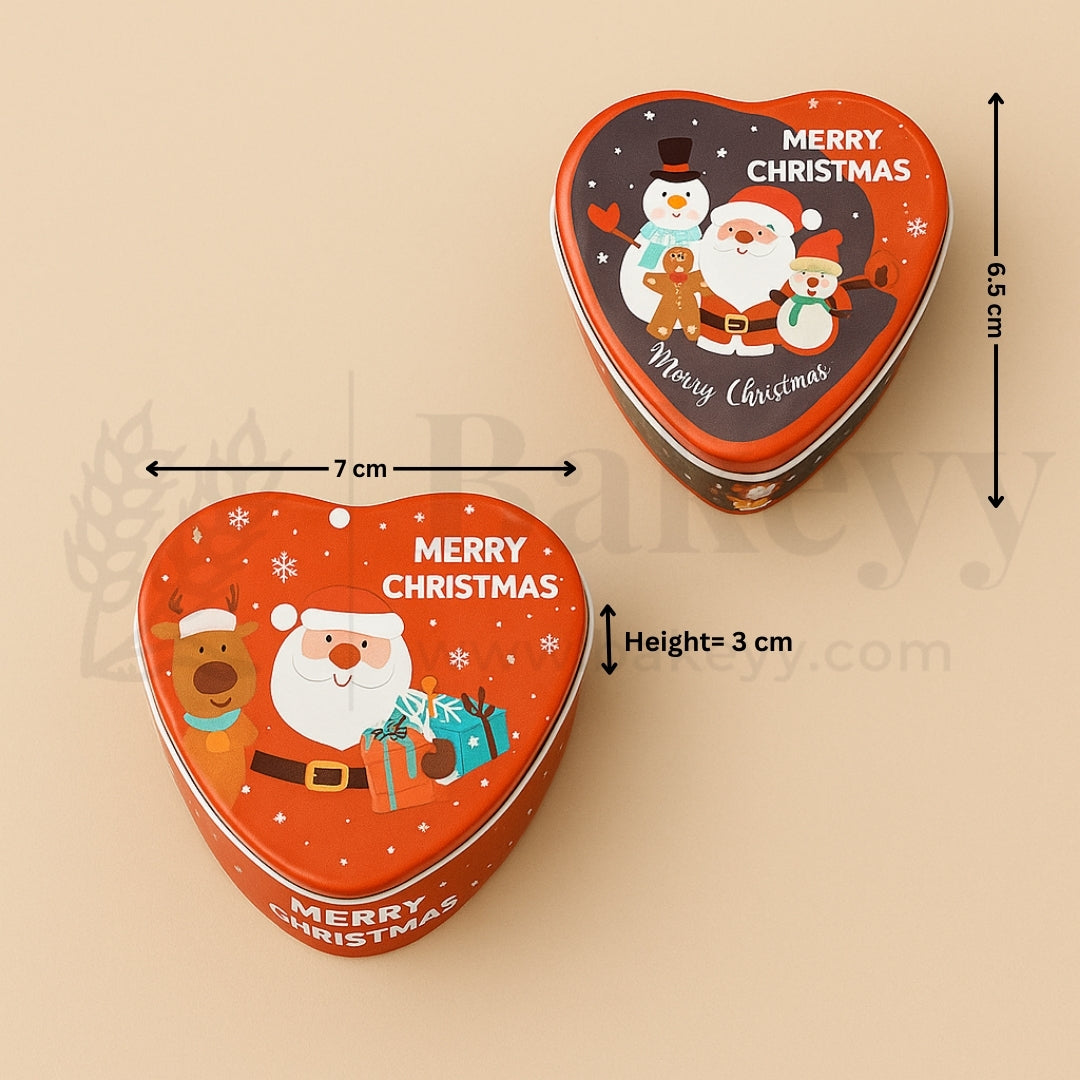 Heart-shaped Christmas tin with Santa Claus and snowman design, showing dimensions on a beige background.