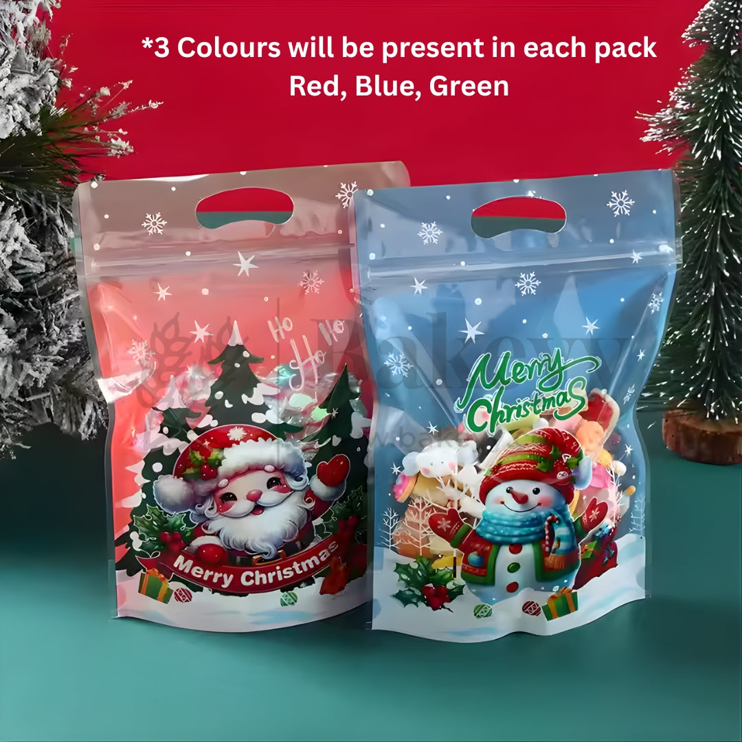 Two Christmas-themed packaging bags with Santa Claus and snowman designs on a green background.