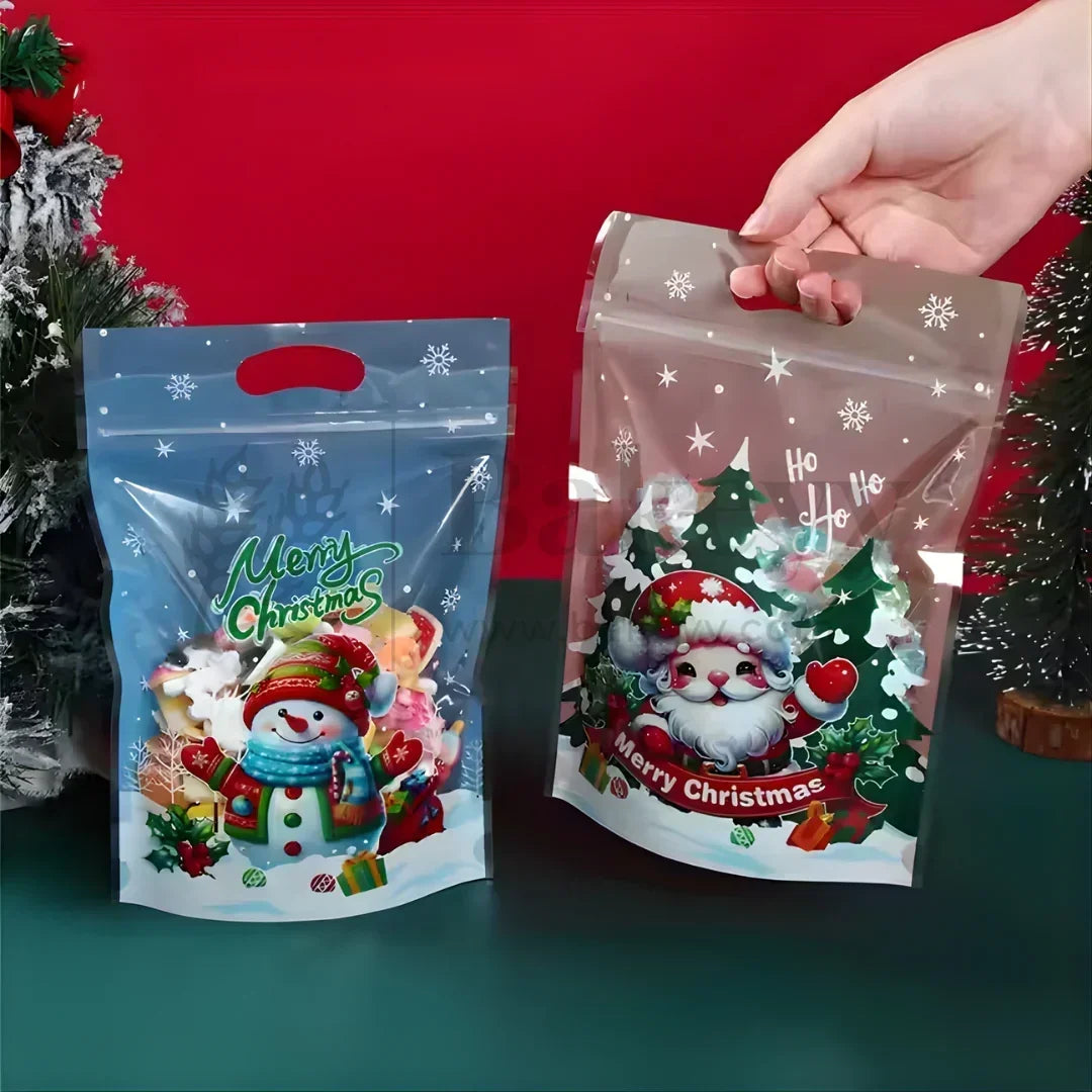 Two Christmas-themed packaging bags with Santa Claus and snowman designs on a red and green background.