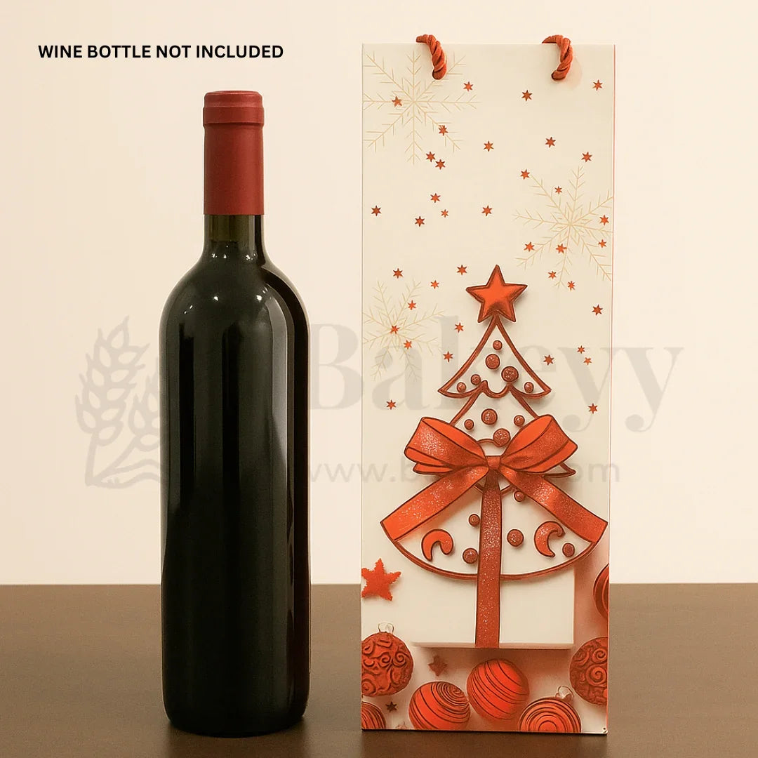 Wine bottle with red cap next to a decorative wine bag with Christmas tree design on a beige background.