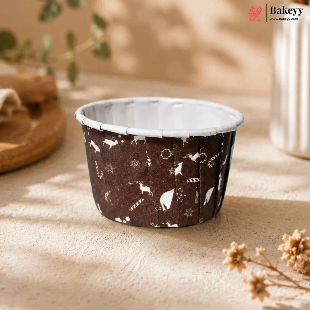 Small round container with animal pattern on a beige surface, featuring the brand 'Bakeyy'.