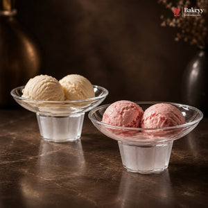 Two glass bowls with vanilla and pink ice cream on a dark surface, featuring the Bakey brand.