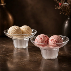 Two glass bowls with vanilla and pink ice cream on a dark surface, featuring the Bakey brand.