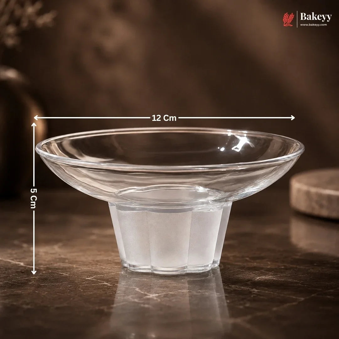 Clear glass bowl with dimensions on a dark surface, featuring the Bakeey brand.