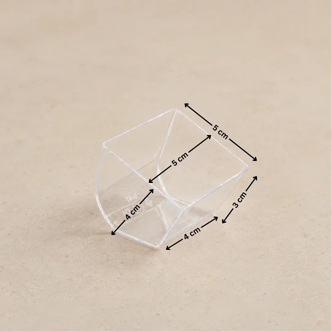 A clear plastic geometric container shown on a beige background with black dimension arrows and labels indicating measurements of 5 cm, 4 cm, and 3 cm.
