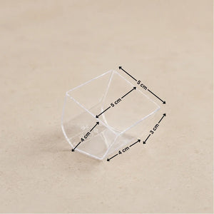 A clear plastic geometric container shown on a beige background with black dimension arrows and labels indicating measurements of 5 cm, 4 cm, and 3 cm.