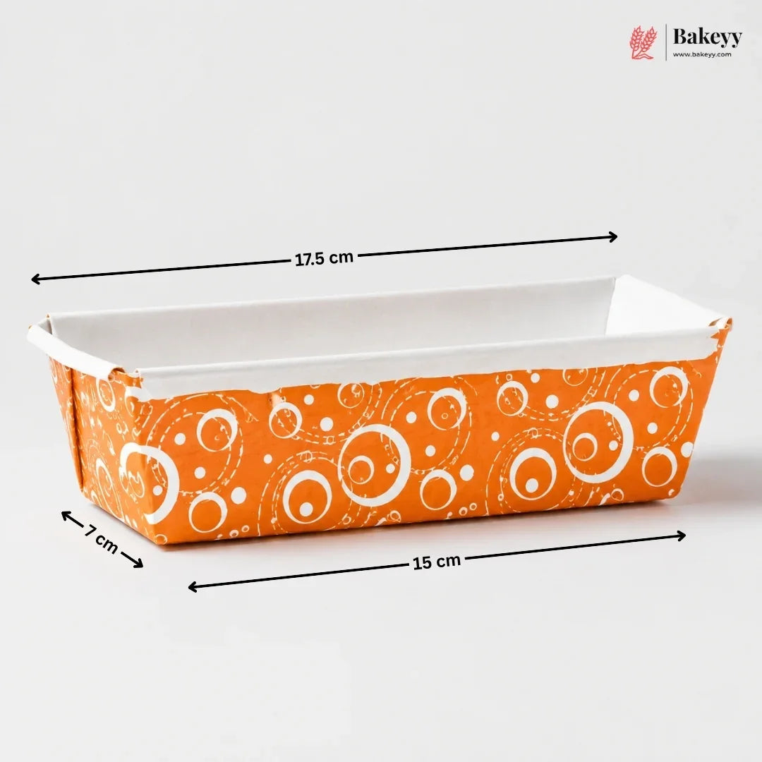 Bakeware loaf pan with orange and white pattern, measurements indicated, on a white background