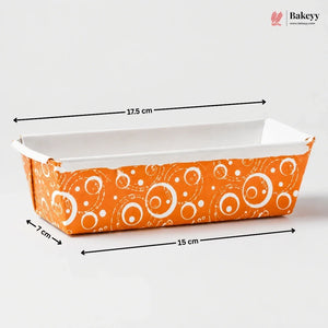 Bakeware loaf pan with orange and white pattern, measurements indicated, on a white background