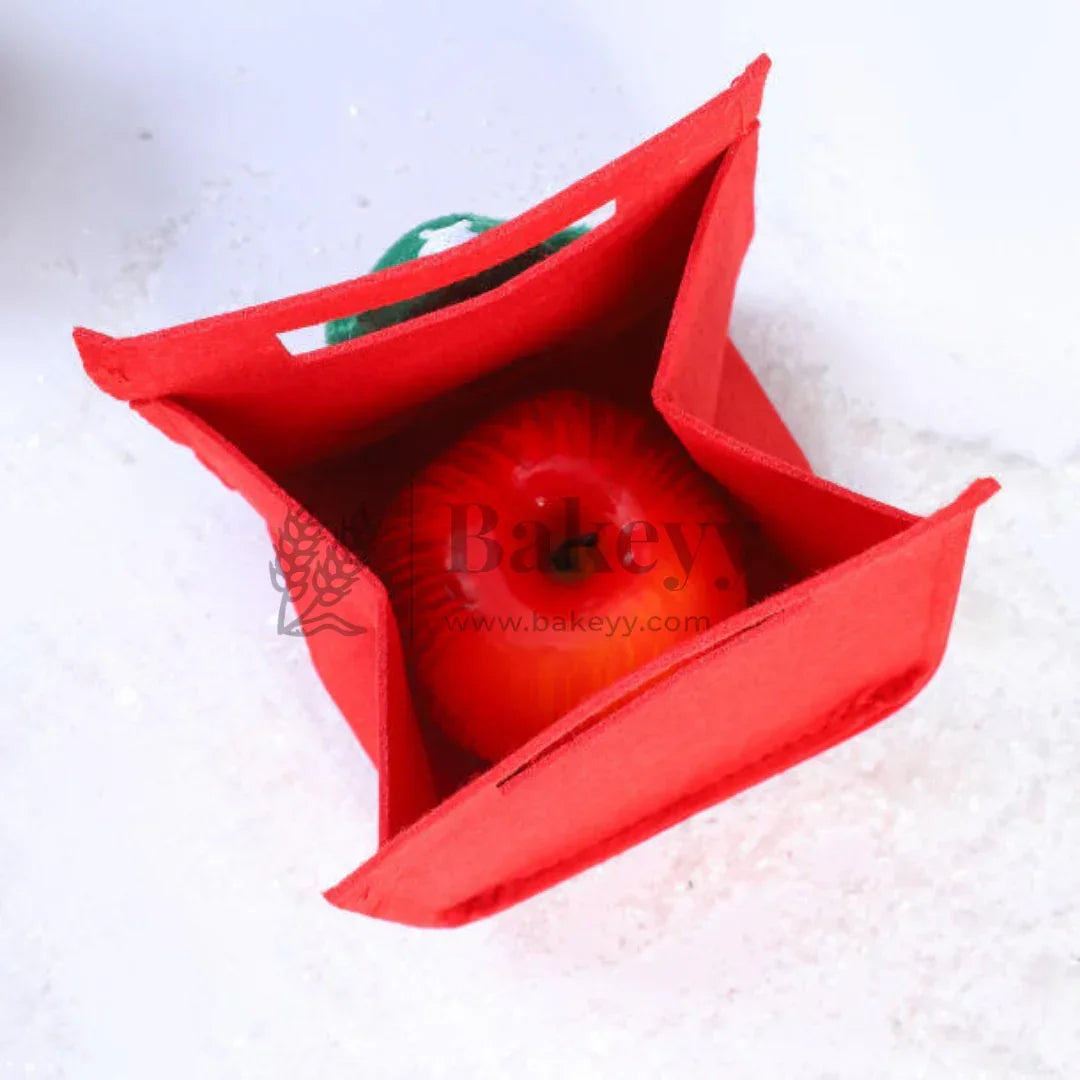 Red fabric bag with a tomato inside on a white background, featuring the brand 'Bakeyy'.