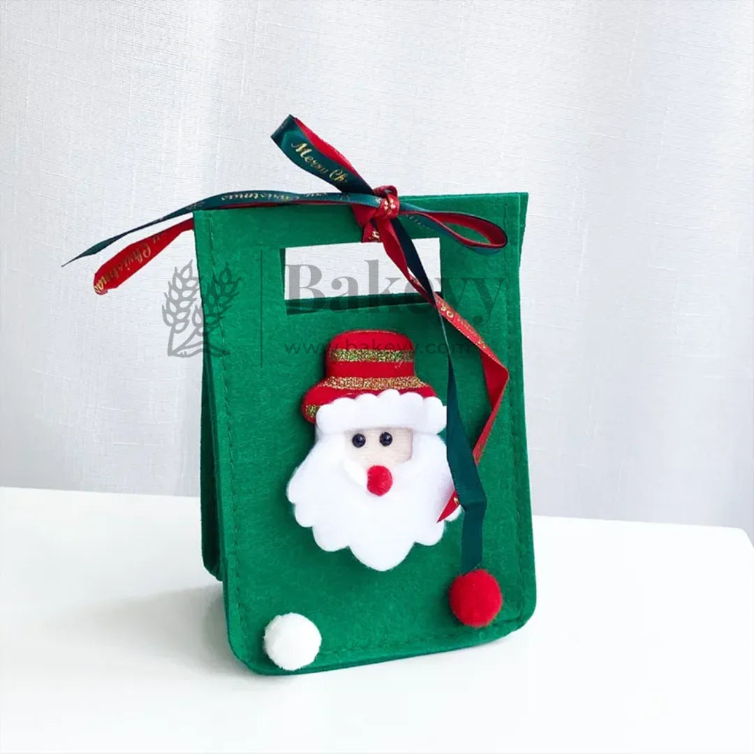 Green felt bag with a Santa Claus decoration on a white background