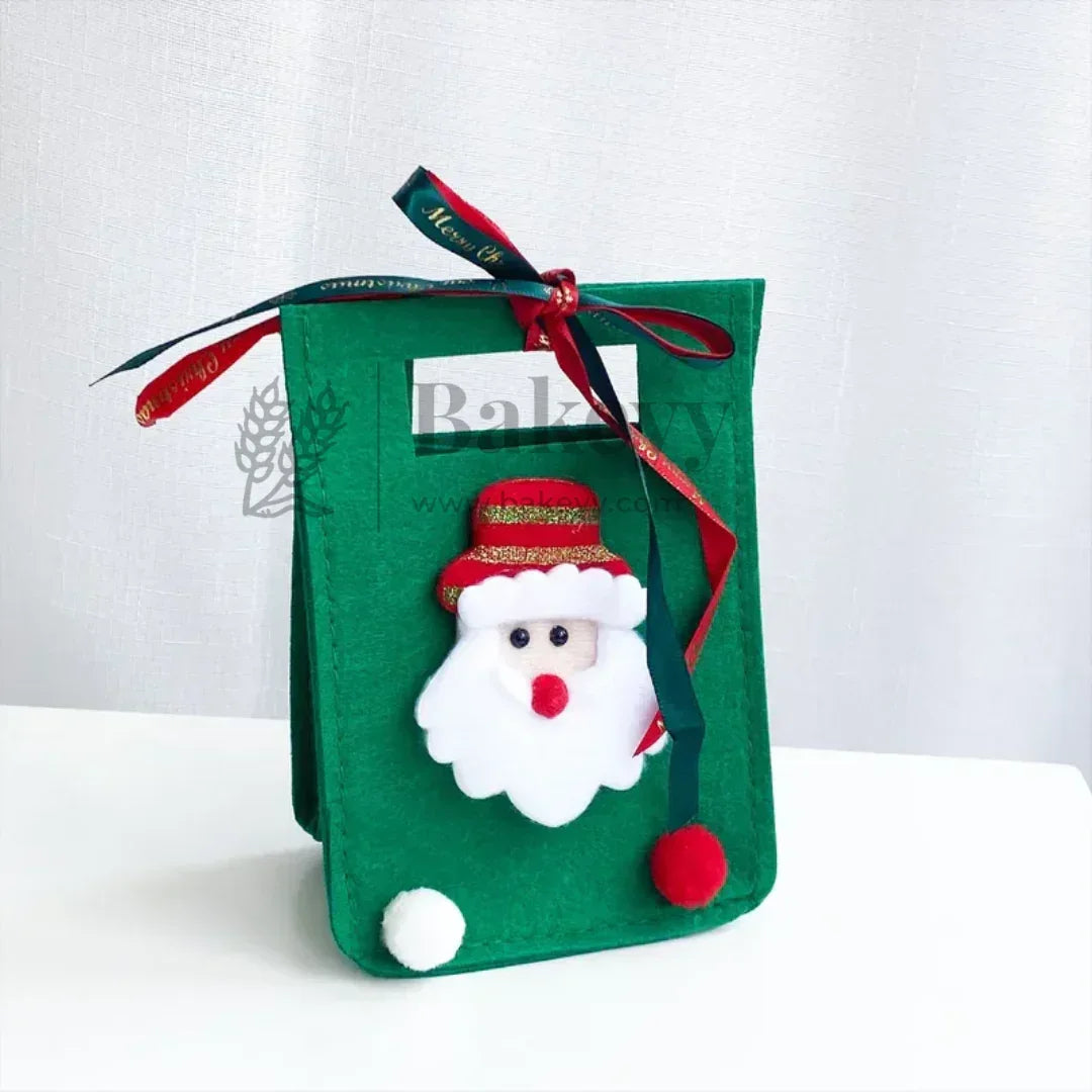 Green felt bag with a Santa Claus decoration on a white background
